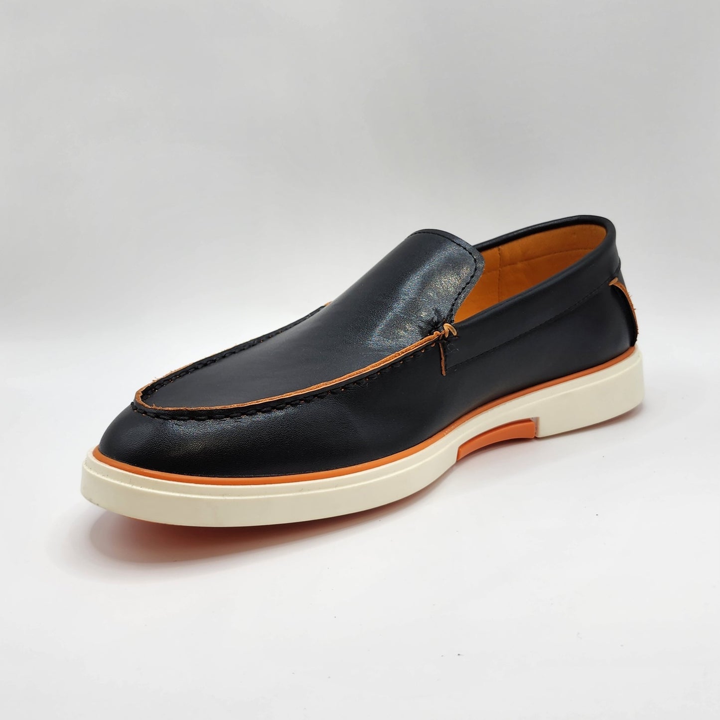 Black leather loafers with orange shade